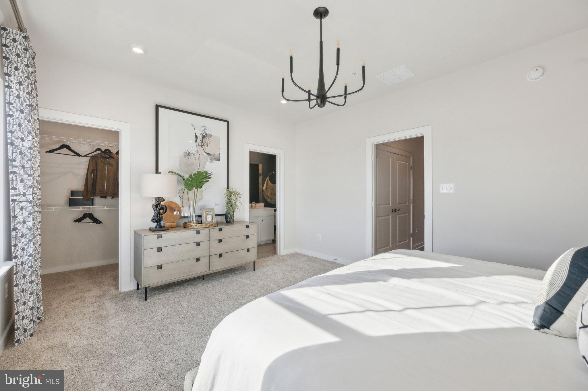 10939 Pinnacle Green Road Upper Marlboro, MD 20772 - Photo 21 of 43 a bedroom with a bed chandelier and dresser