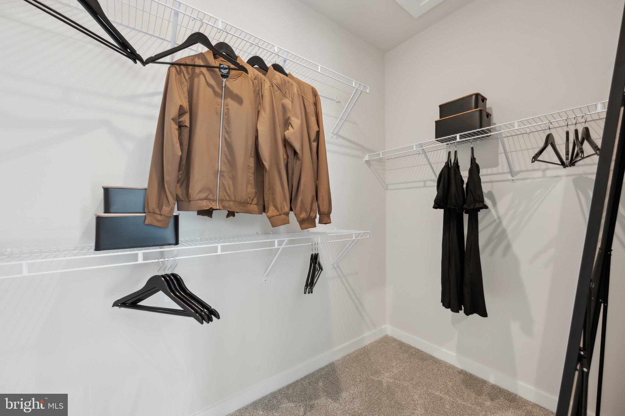 10939 Pinnacle Green Road Upper Marlboro, MD 20772 - Photo 22 of 43 a view of walk in closet with clothes and shoes