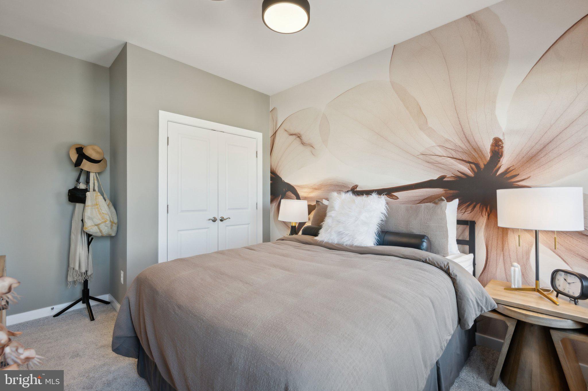 10939 Pinnacle Green Road Upper Marlboro, MD 20772 - Photo 29 of 43 a bedroom with a bed and a chandelier