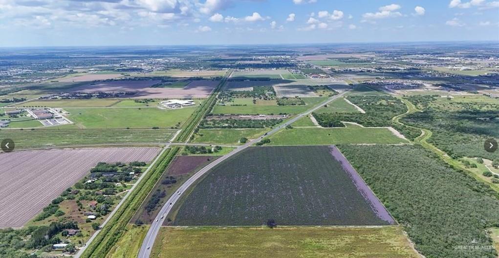 a view of a swimming pool with a yard