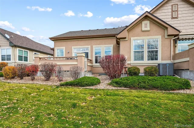 a front view of a house with a yard and porch