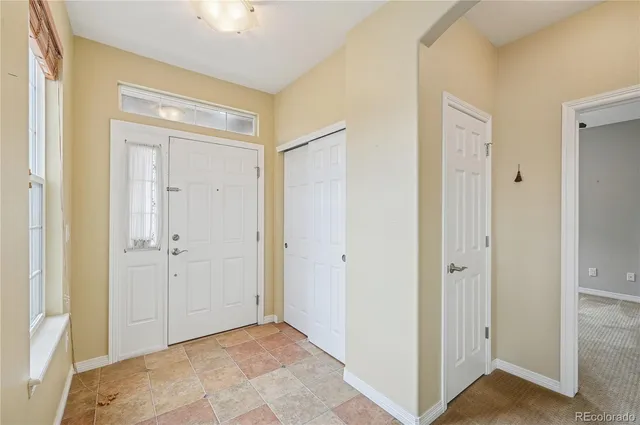 a view of a hallway with closet area