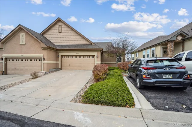 a view of a car park in front of house