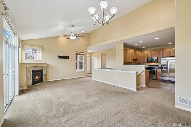 a view of a kitchen with a sink and a kitchen counter top space