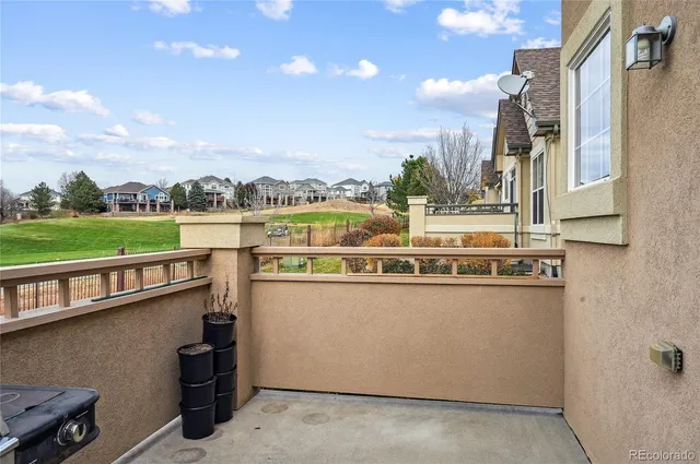 a view of a city with lawn chairs