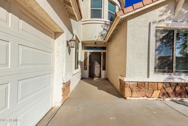 a picture of a bathroom with a shower and a sink