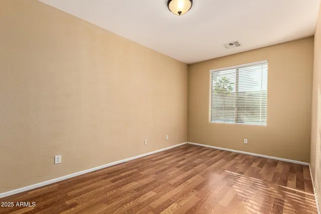 a kitchen with kitchen island granite countertop stainless steel appliances cabinets a sink and a counter top space