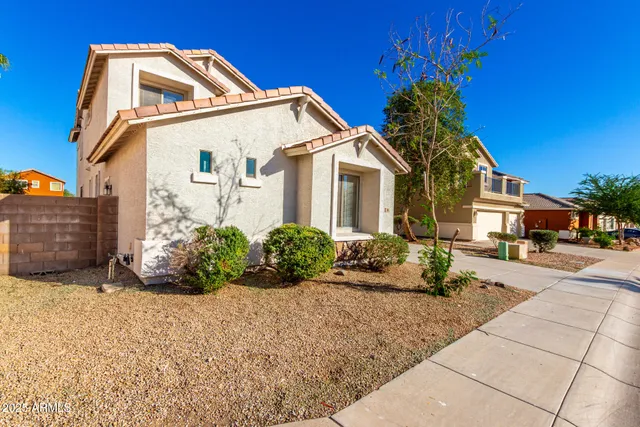 a picture of a bathroom with a shower and a sink