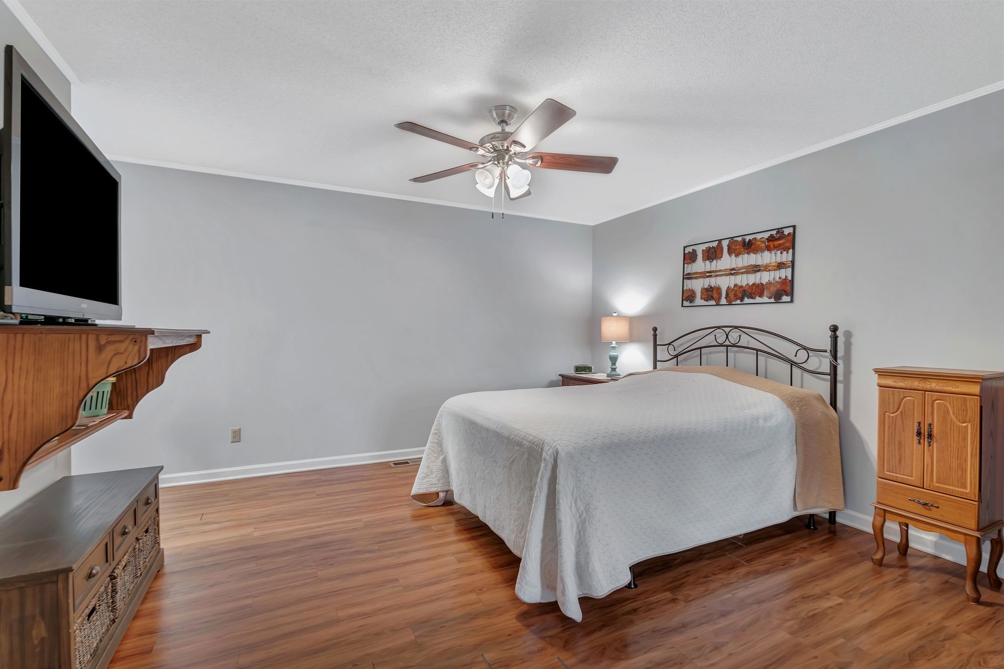 1210 Hills Chapel Road Manchester, TN 37355 - Photo 17 of 33 a bedroom with a bed and a flat screen tv