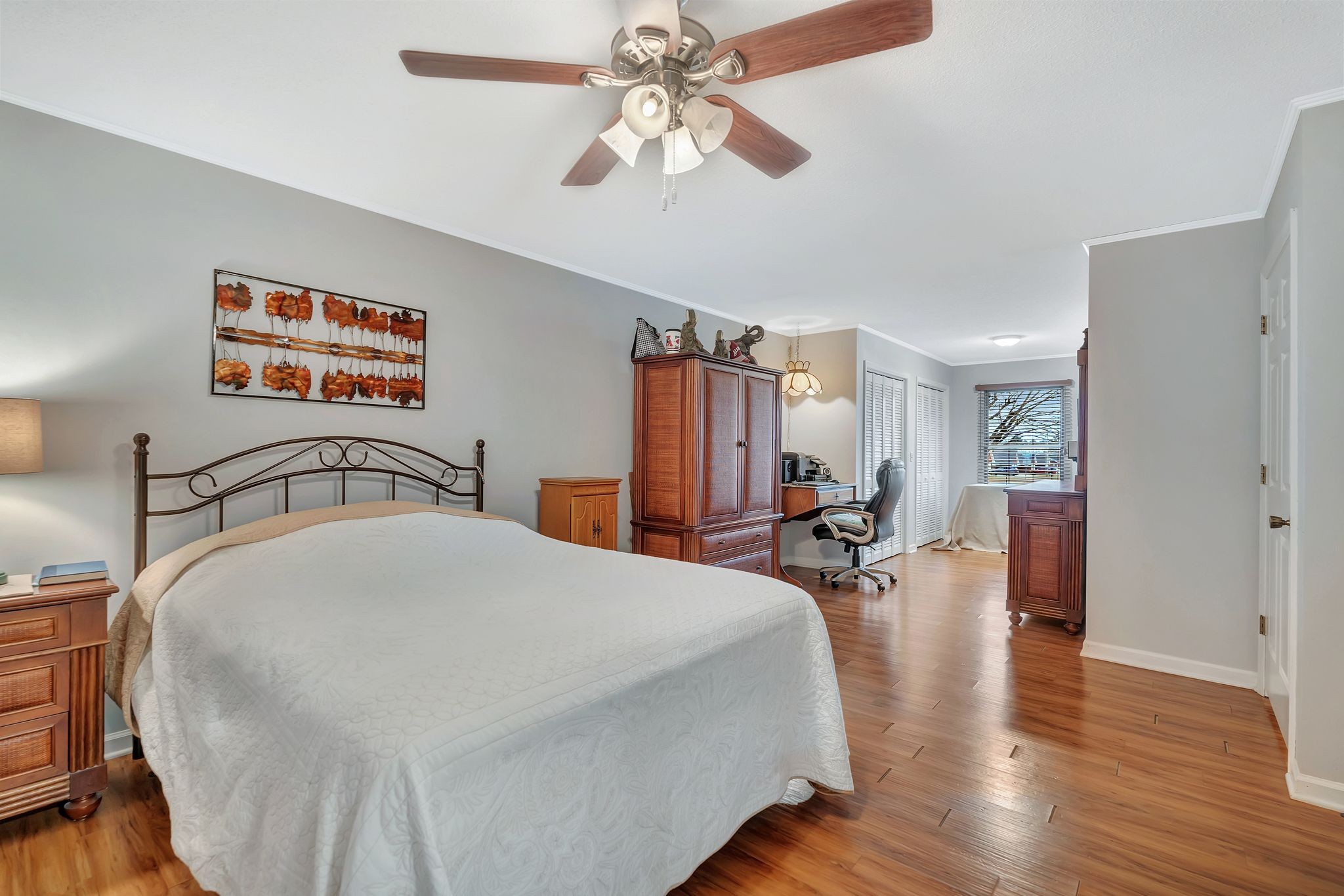 1210 Hills Chapel Road Manchester, TN 37355 - Photo 18 of 33 a bed room with a bed and a chandelier