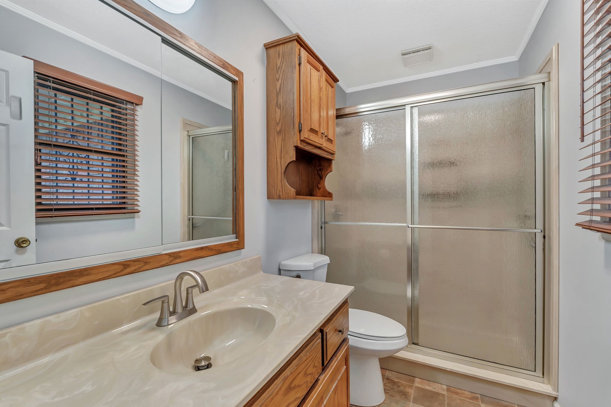 1210 Hills Chapel Road Manchester, TN 37355 - Photo 21 of 33 a bathroom with a sink toilet and shower