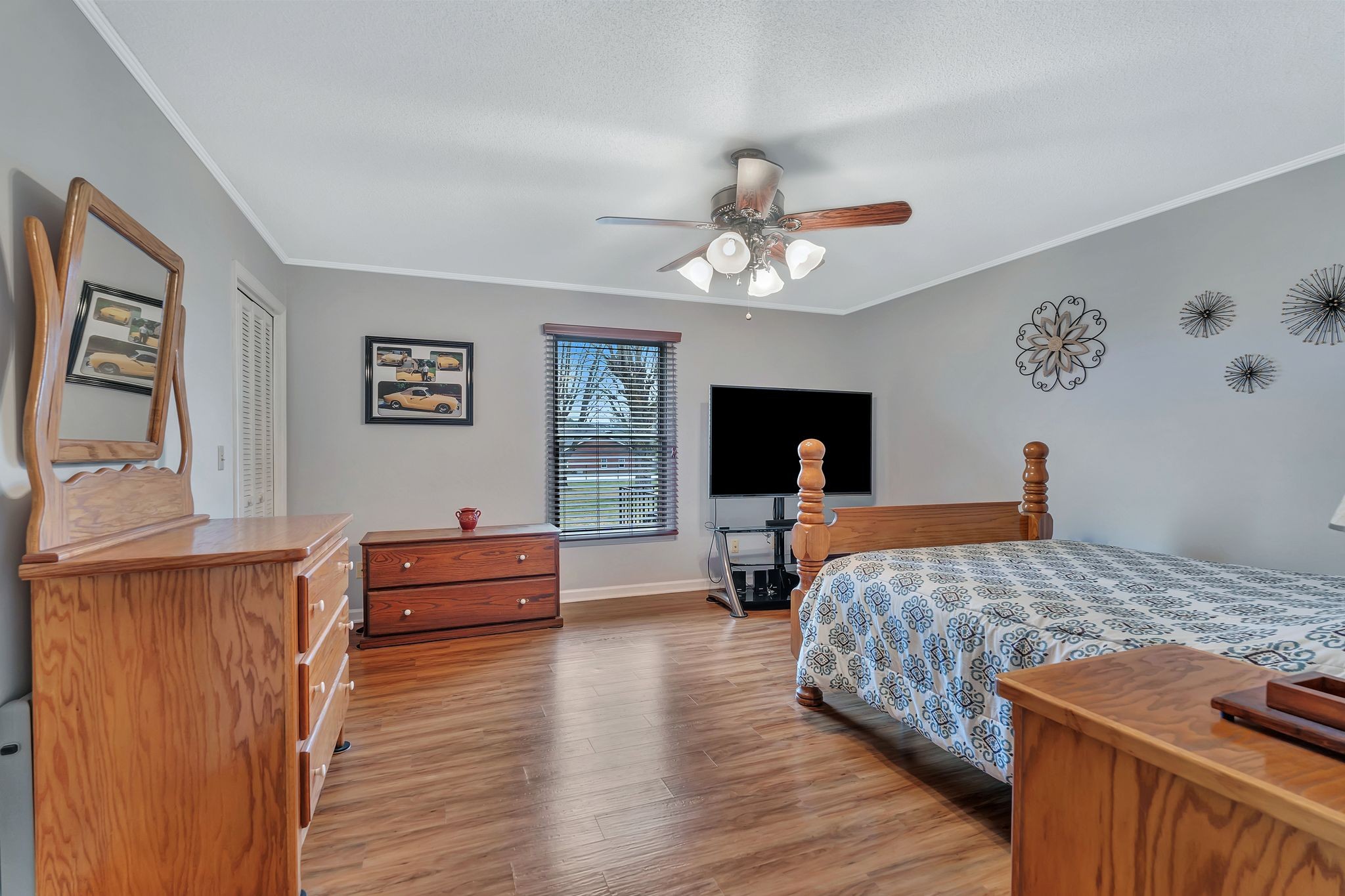 1210 Hills Chapel Road Manchester, TN 37355 - Photo 22 of 33 a bedroom with furniture and a wooden floor