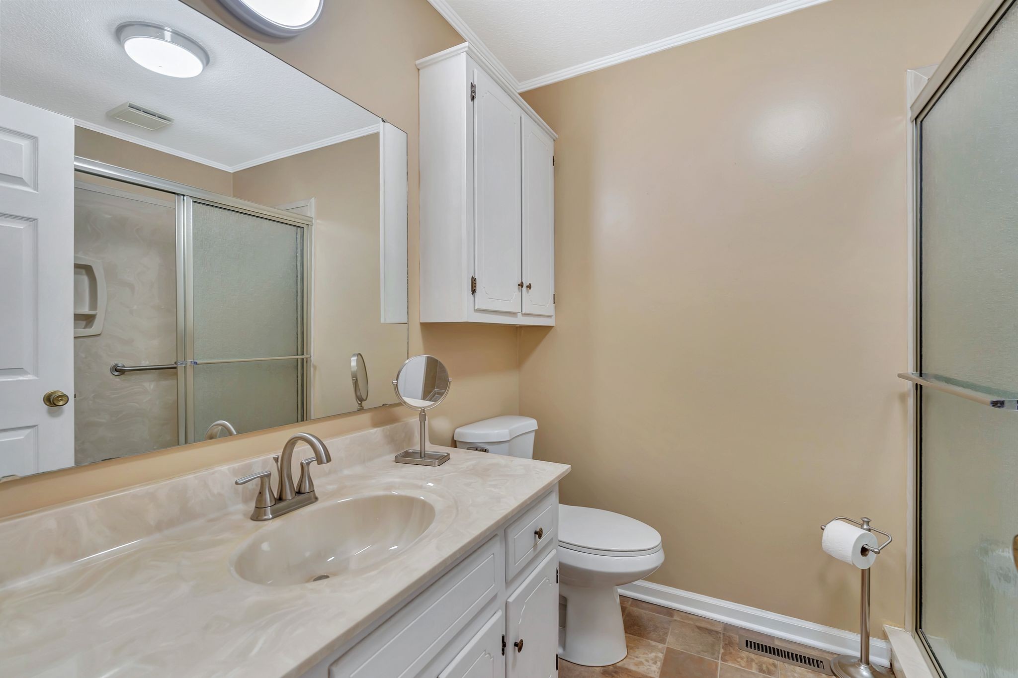 1210 Hills Chapel Road Manchester, TN 37355 - Photo 23 of 33 a bathroom with a granite countertop sink toilet and shower