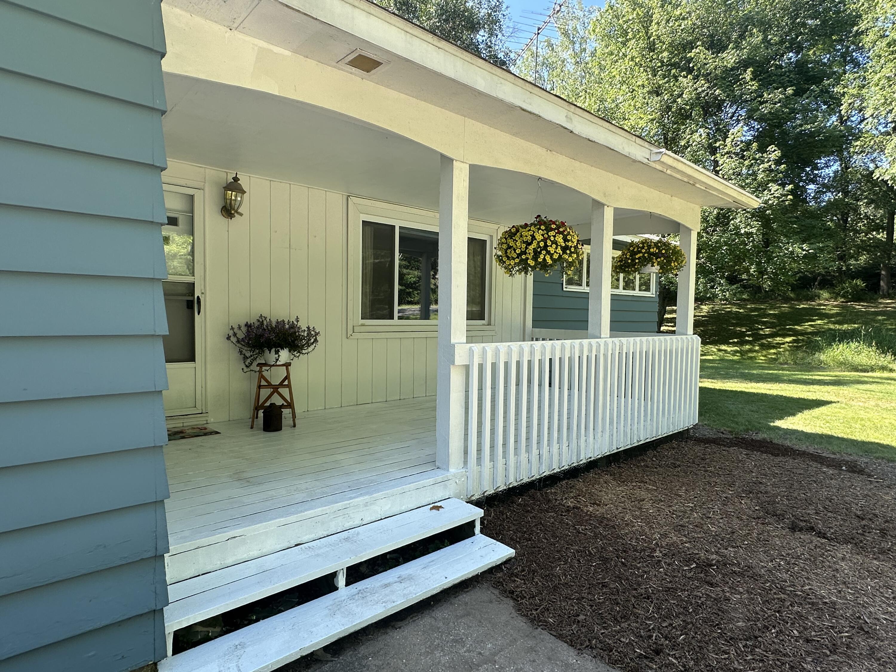 1978 Lakeshore Road Manistee, MI 49660 - Photo 2 of 37 Relax on your front porch!