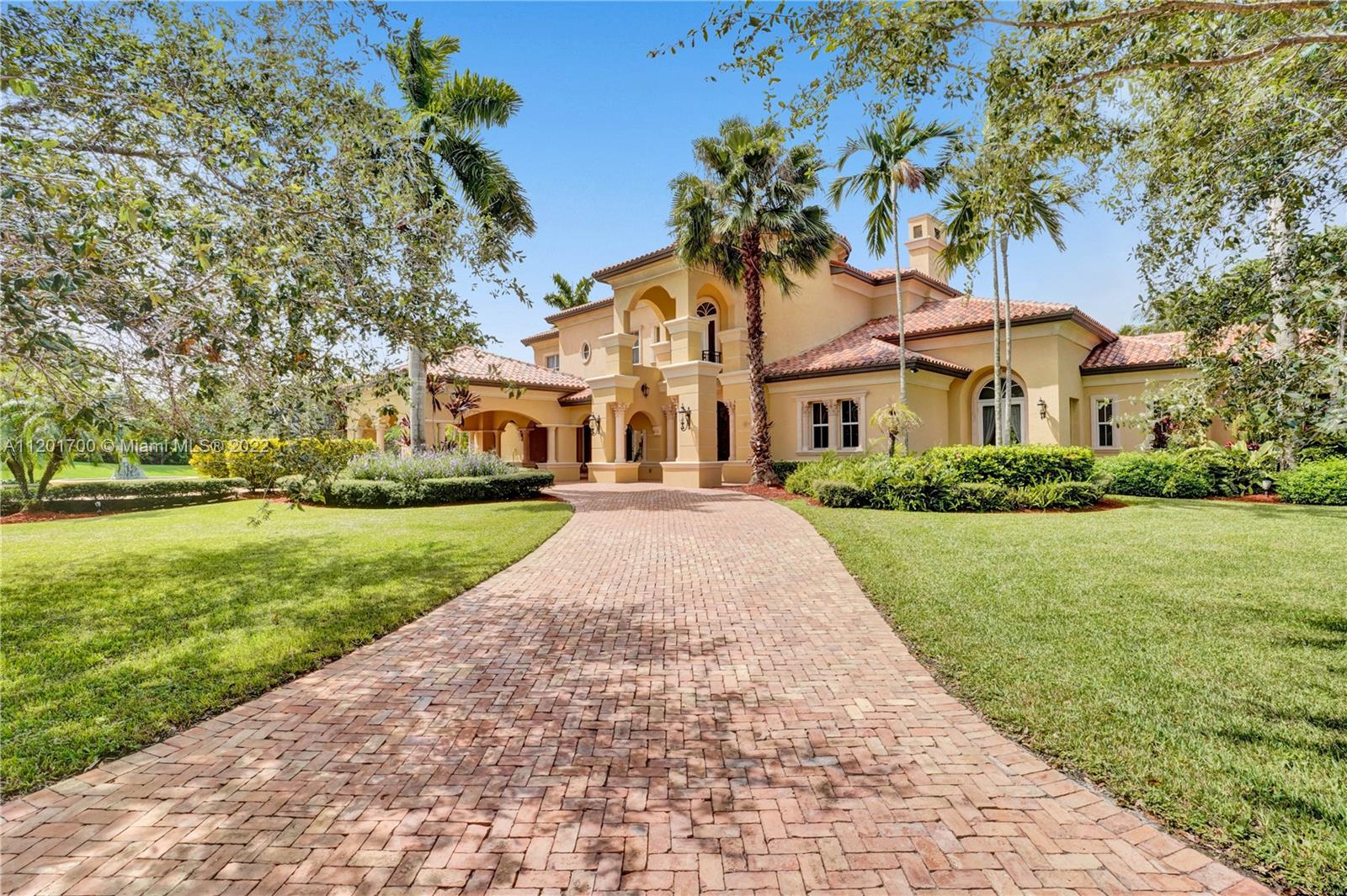 3460 Paddock Road Weston, FL 33331 - Photo 1 of 62 a front view of house with yard and green space
