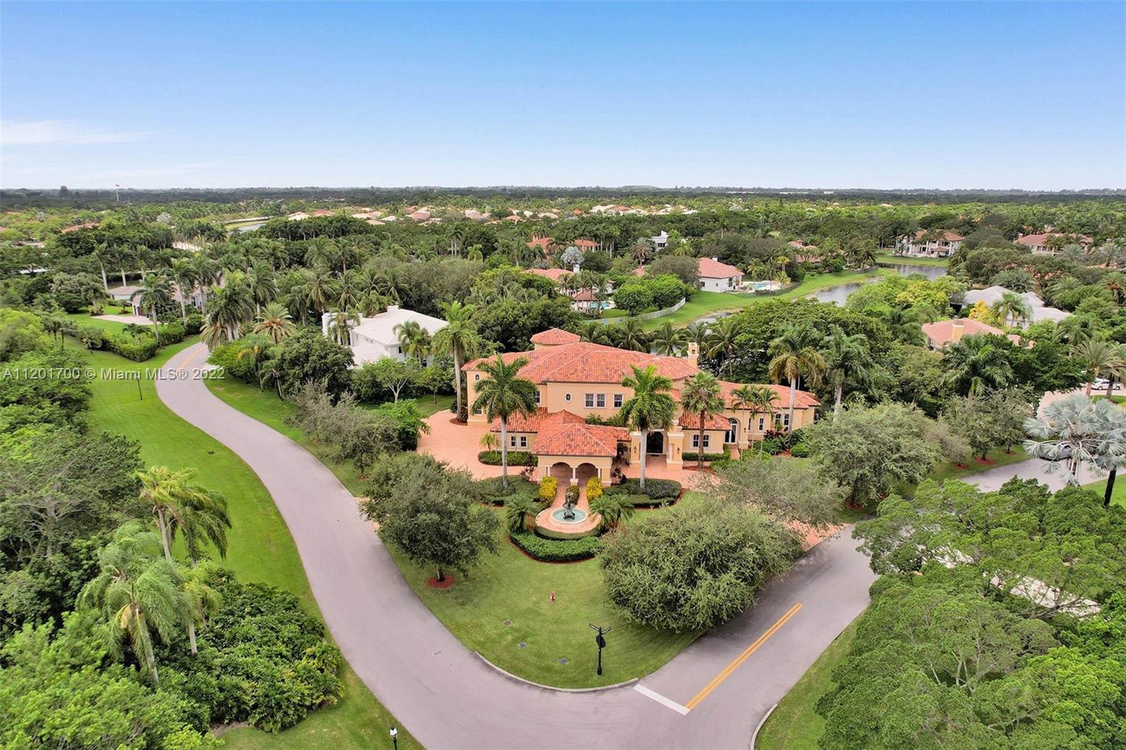 3460 Paddock Road Weston, FL 33331 - Photo 61 of 62 an aerial view of residential houses with outdoor space and trees