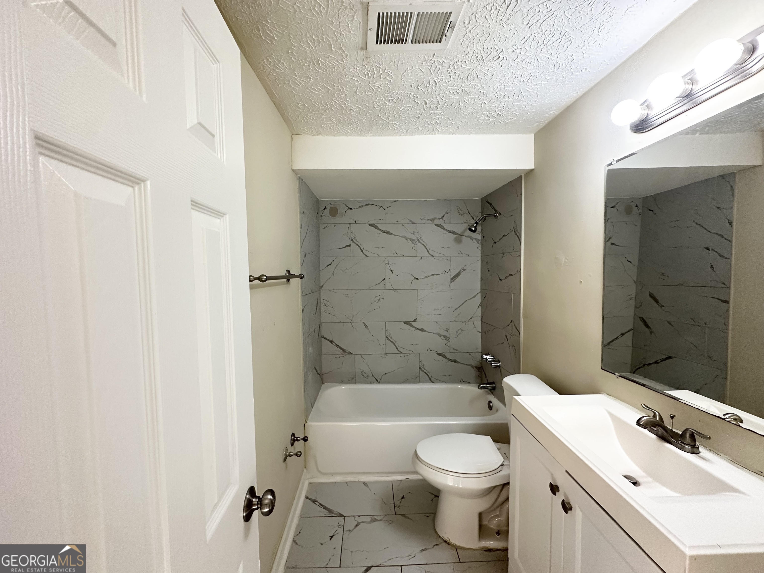 1876 Flat Shoals Road Southeast Atlanta, GA 30316 - Photo 6 of 11 a bathroom with a sink a toilet and shower
