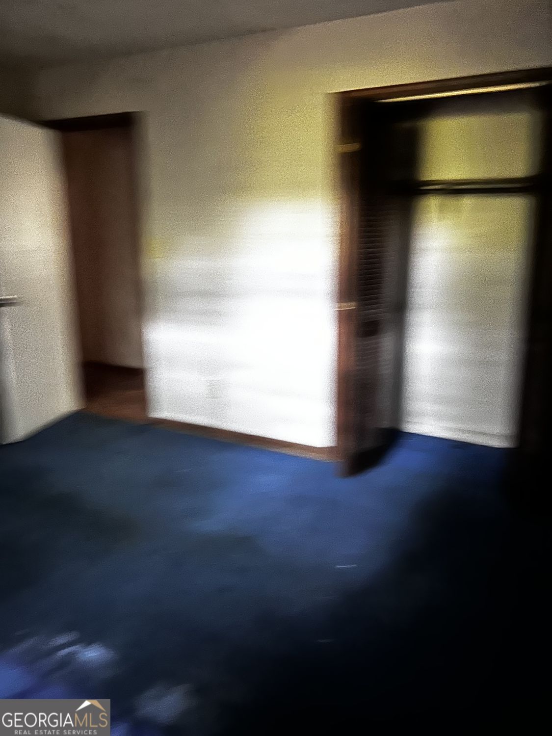 610 Roy Huie Road Riverdale, GA 30274 - Photo 16 of 24 a view of empty room with wooden floor and fan