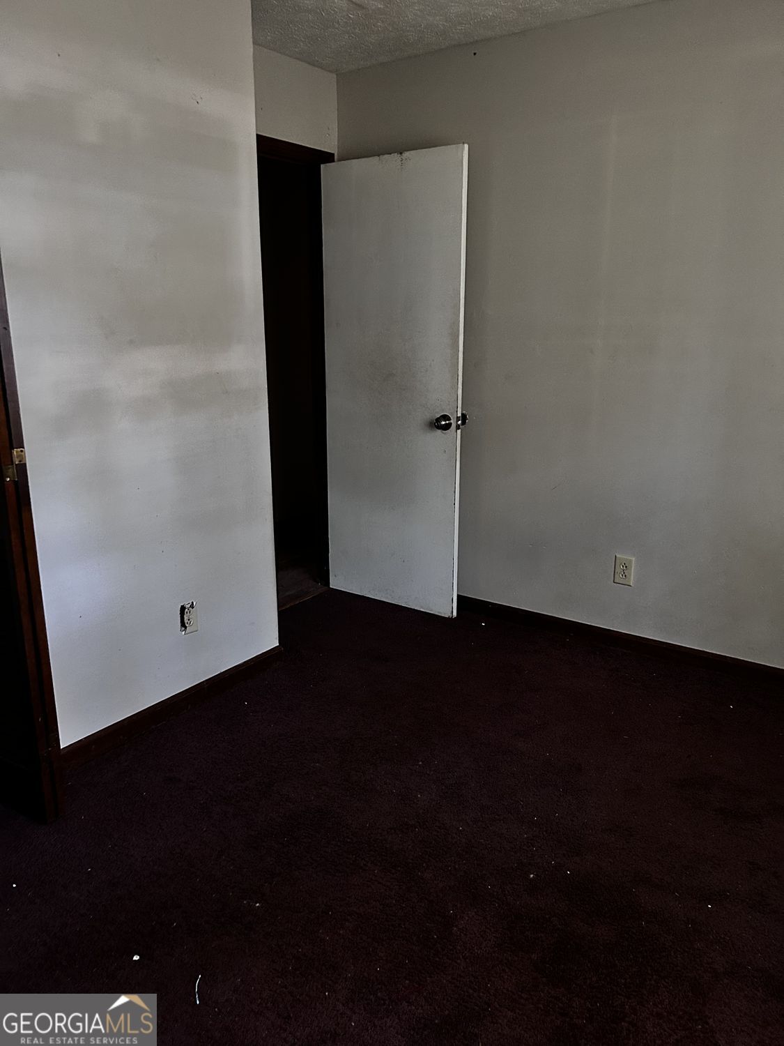 610 Roy Huie Road Riverdale, GA 30274 - Photo 18 of 24 an empty room with wooden floor