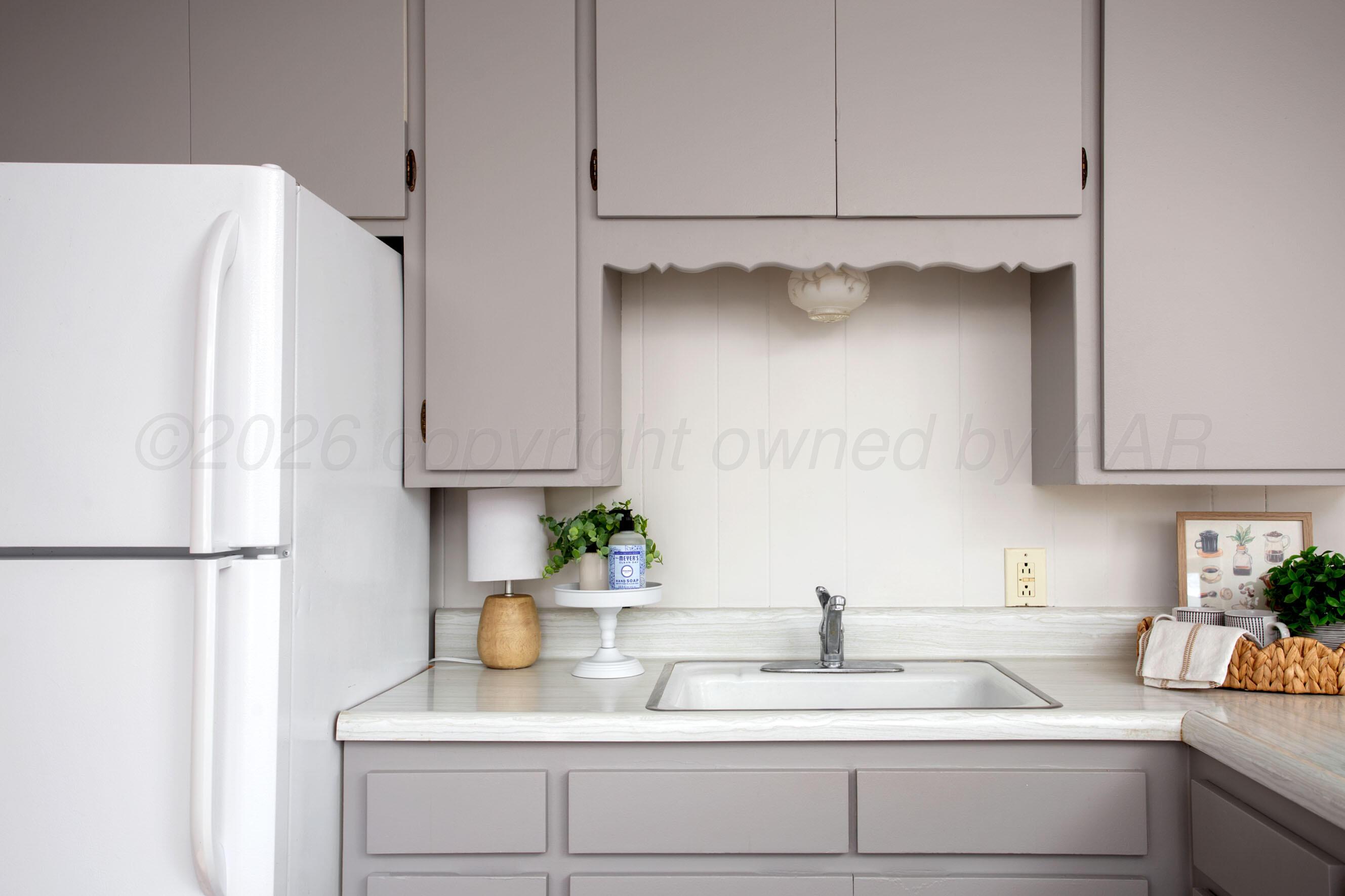 1107 Main Street Panhandle, TX 79068 - Photo 13 of 24 a kitchen with appliances and cabinets