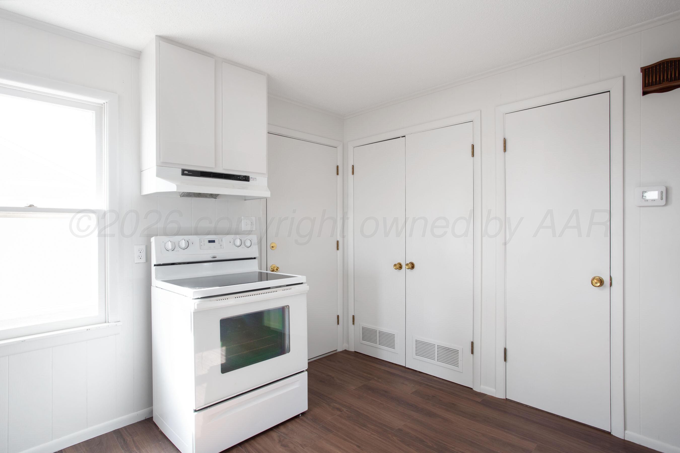 1107 Main Street Panhandle, TX 79068 - Photo 14 of 24 a view of a storage and utility room with washer and dryer