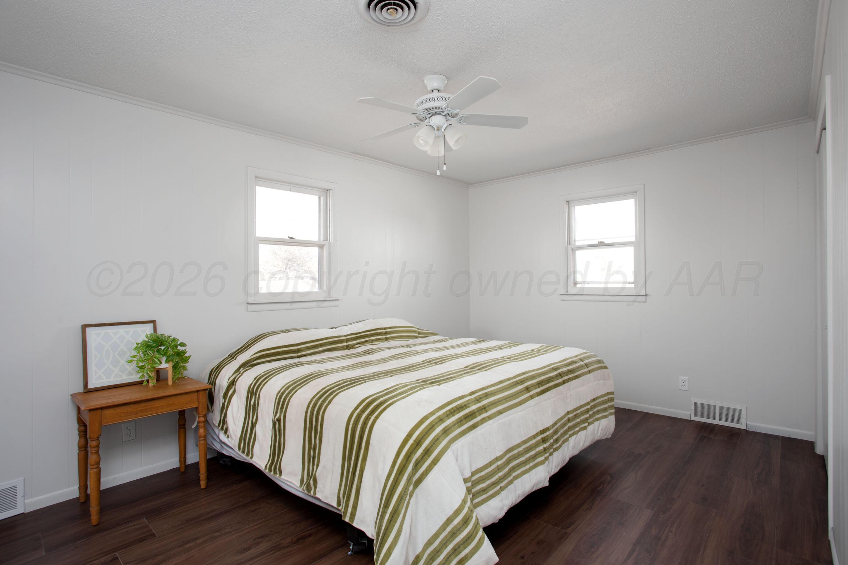 1107 Main Street Panhandle, TX 79068 - Photo 15 of 24 a bedroom with a bed and a window