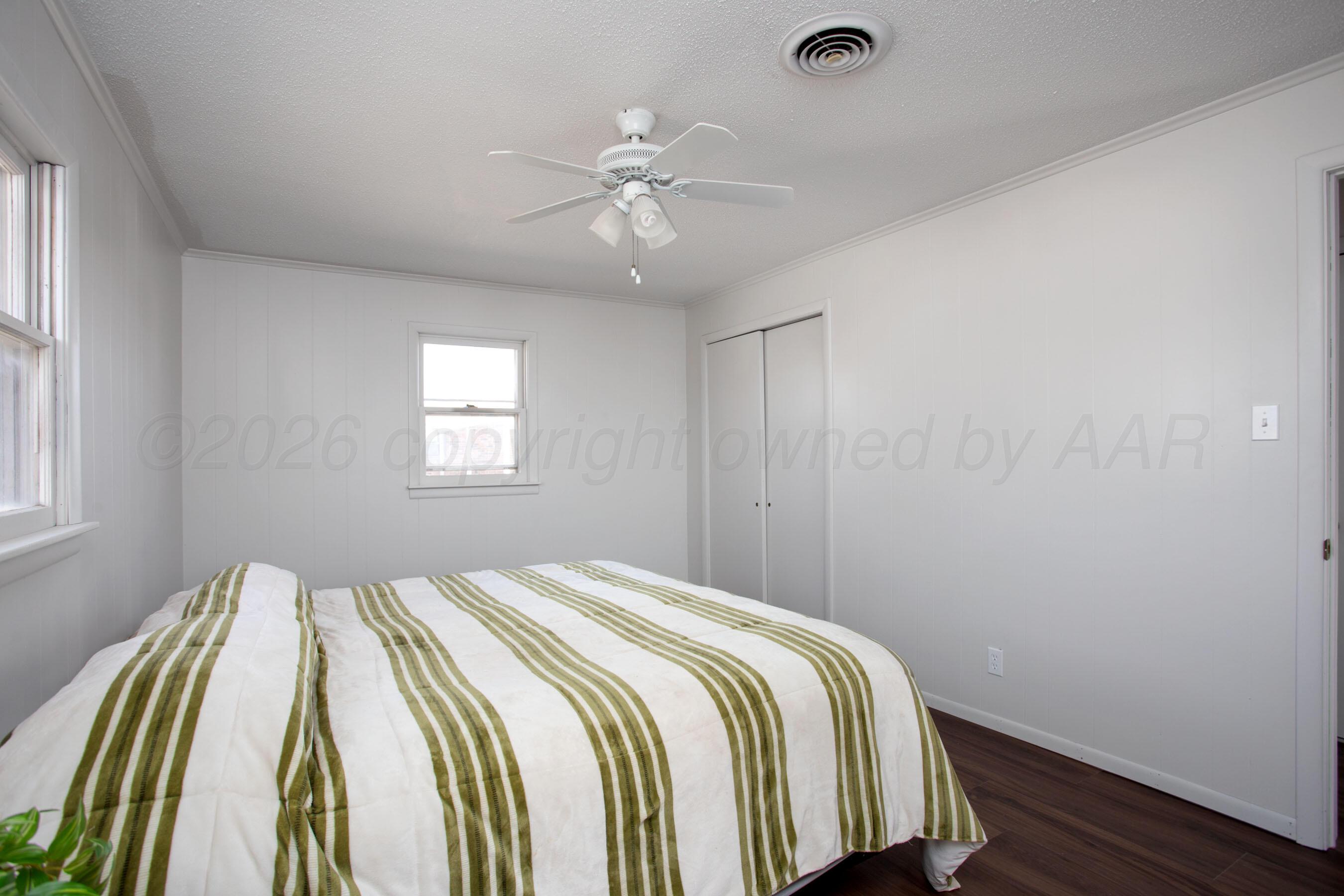 1107 Main Street Panhandle, TX 79068 - Photo 17 of 24 a bedroom with a bed and window