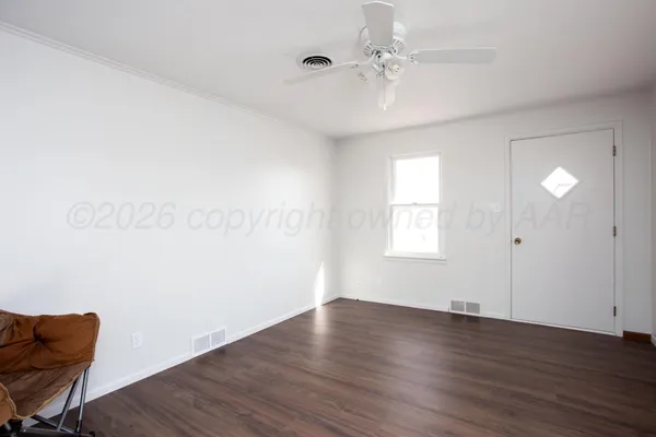 a view of kitchen and wooden floor