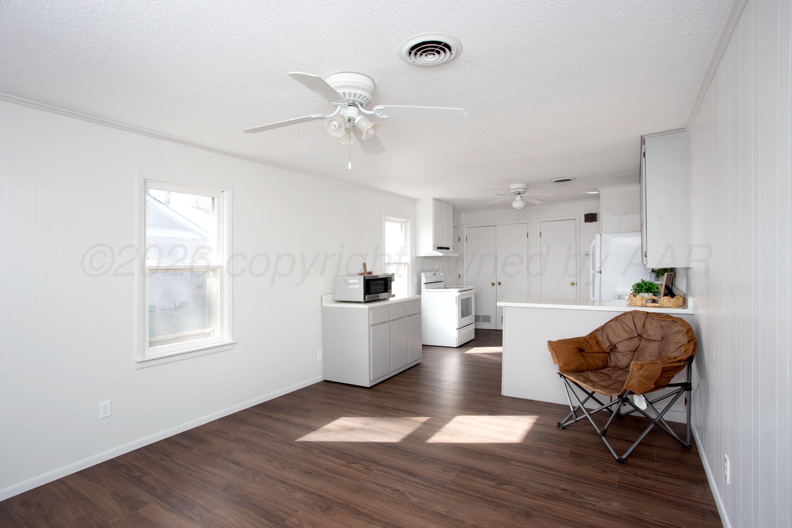 1107 Main Street Panhandle, TX 79068 - Photo 10 of 24 a living room with furniture and a window