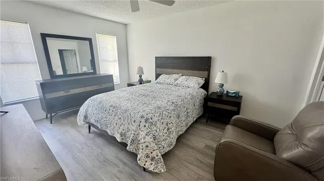 a bedroom with bed and window