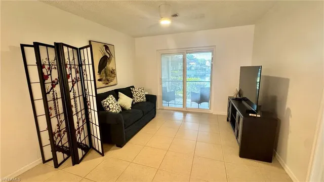 a view of a hallway with couch and furniture