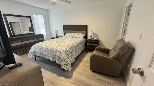 a bedroom with bed and window