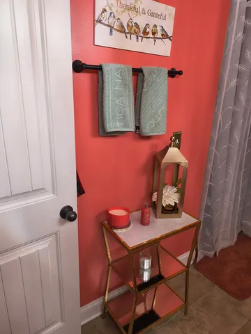 a bathroom with a sink mirror and vanity