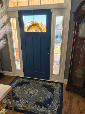 a view of entryway with wooden floor