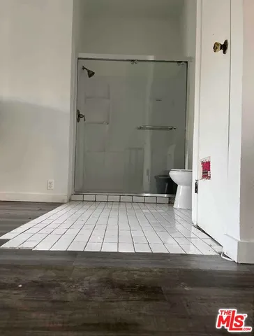 a living room with two couches and a flat screen tv