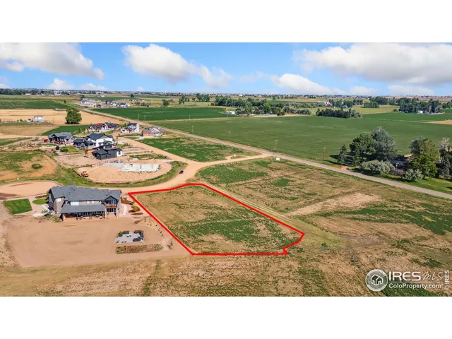 a view of a swimming pool and an outdoor seating