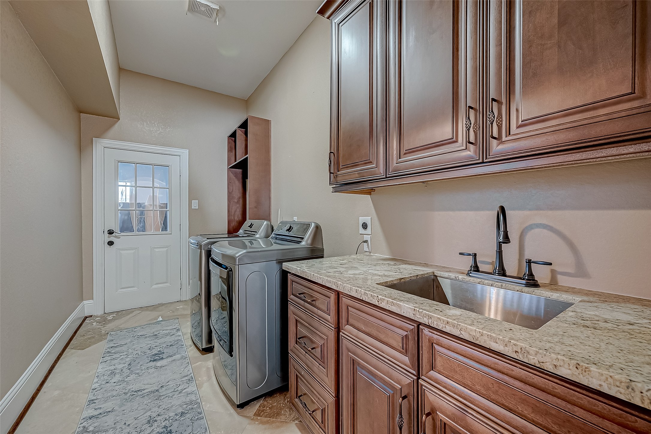 2011 Crescent Drive La Porte, TX 77571 - Photo 17 of 47 a kitchen with stainless steel appliances granite countertop a sink stove and cabinets