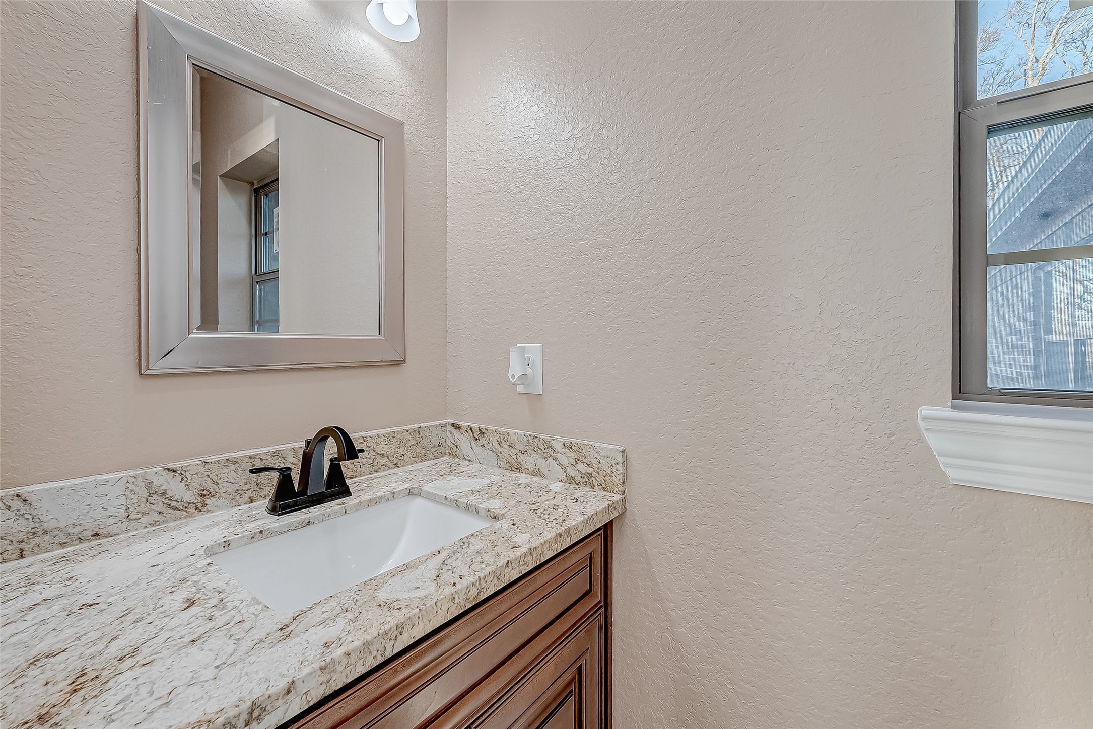 2011 Crescent Drive La Porte, TX 77571 - Photo 24 of 47 a bathroom with a granite countertop sink and a mirror