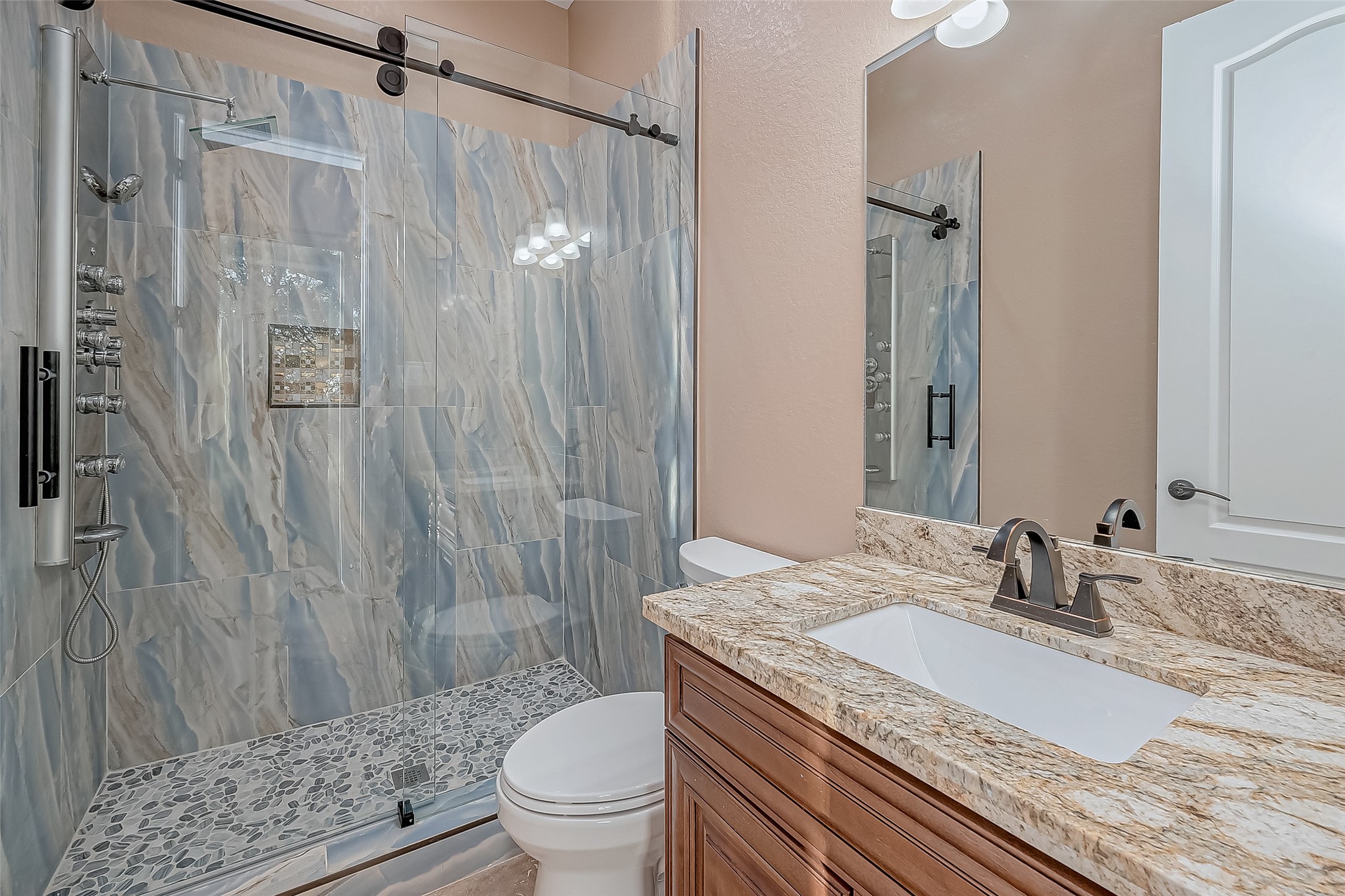 2011 Crescent Drive La Porte, TX 77571 - Photo 25 of 47 a bathroom with a granite countertop sink toilet and shower