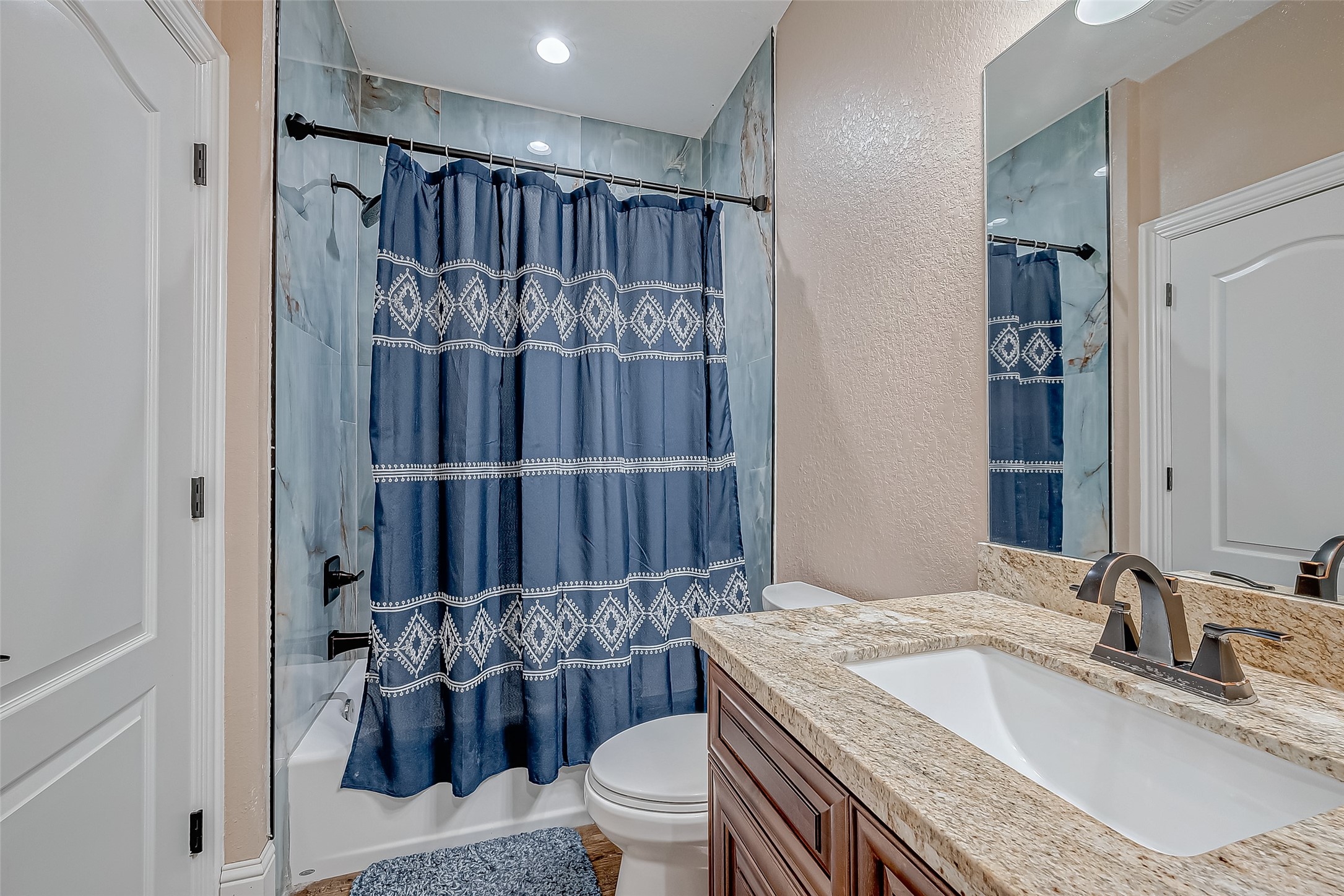 2011 Crescent Drive La Porte, TX 77571 - Photo 27 of 47 a bathroom with a granite countertop sink toilet and shower