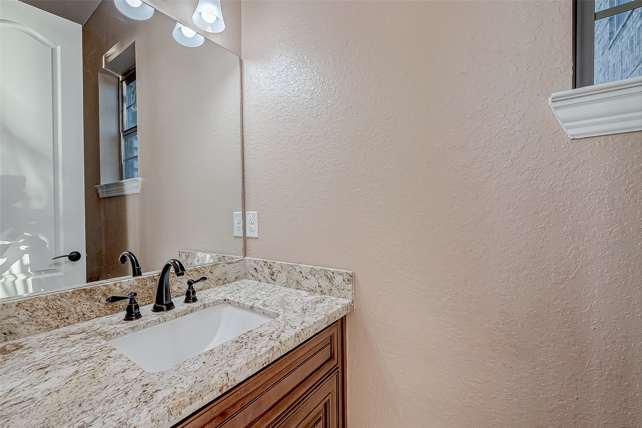 2011 Crescent Drive La Porte, TX 77571 - Photo 35 of 47 a bathroom with a granite countertop sink and a mirror
