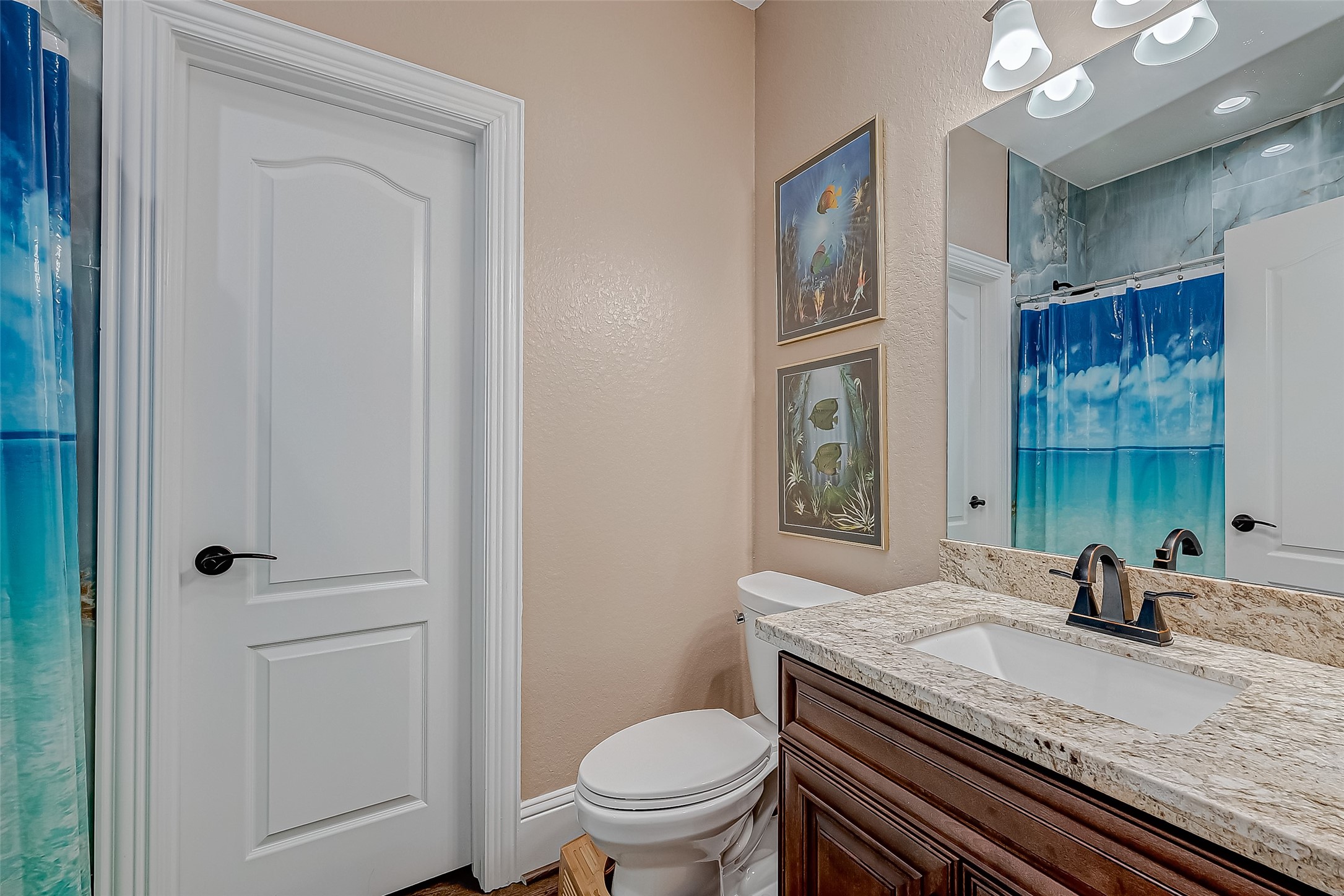 2011 Crescent Drive La Porte, TX 77571 - Photo 38 of 47 a bathroom with a granite countertop sink a toilet and shower