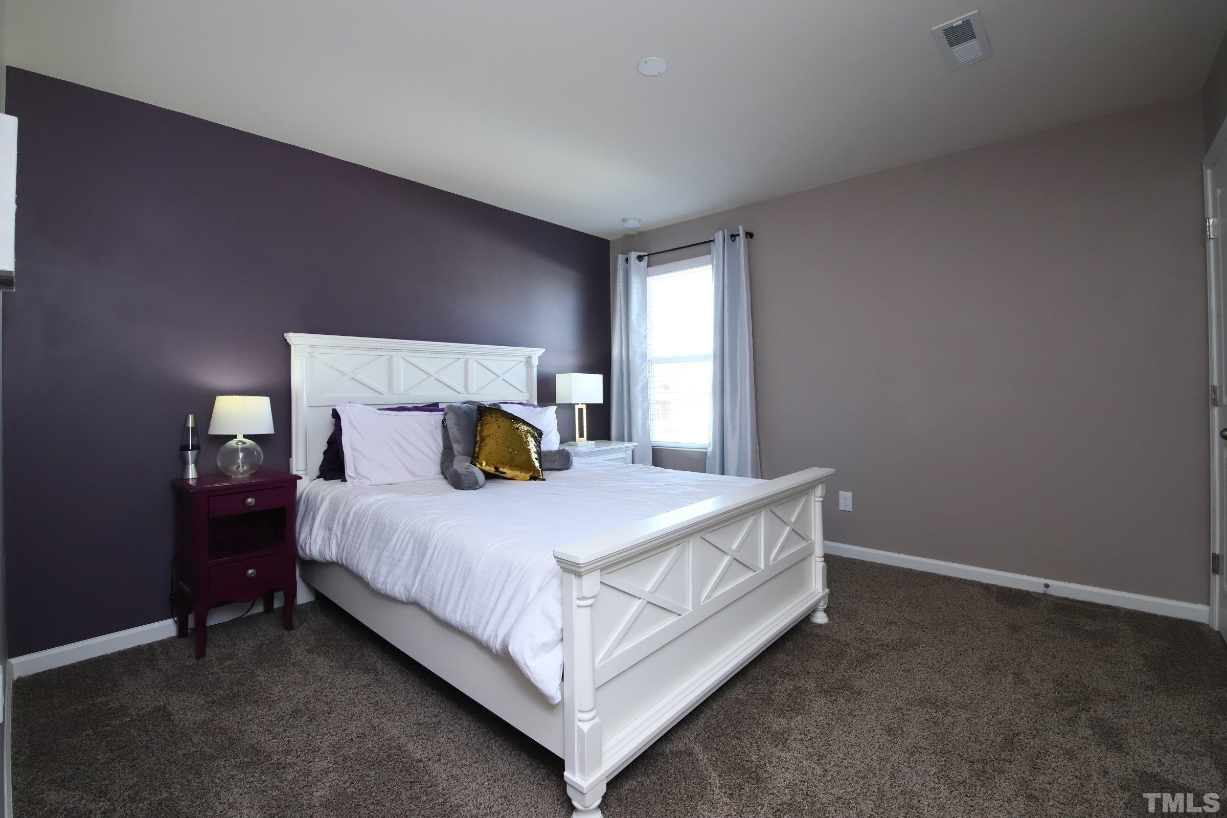 3524 Massey Ridge Court Raleigh, NC 27616 - Photo 22 of 29 a bedroom with a bed and window
