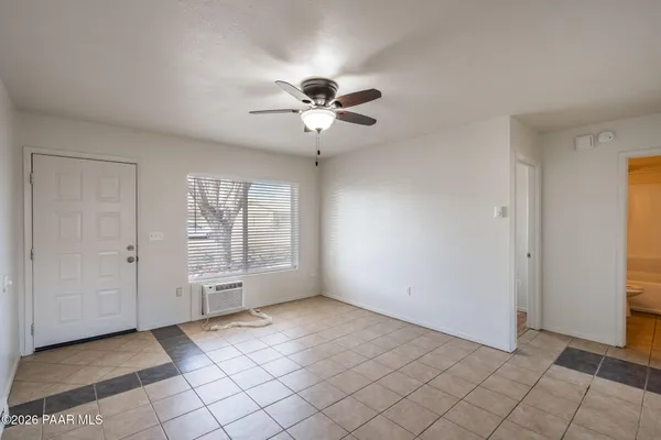 a view of an empty room with a window