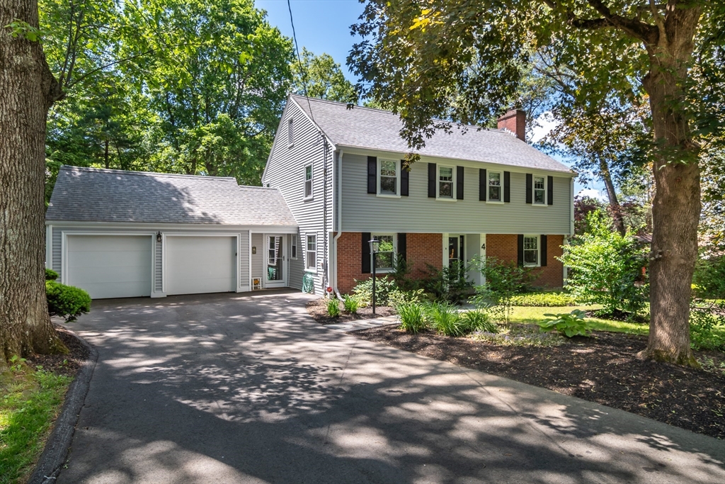 4 Philip Road Lexington, MA 02421 - Photo 1 of 19 a front view of a house with a yard and garage