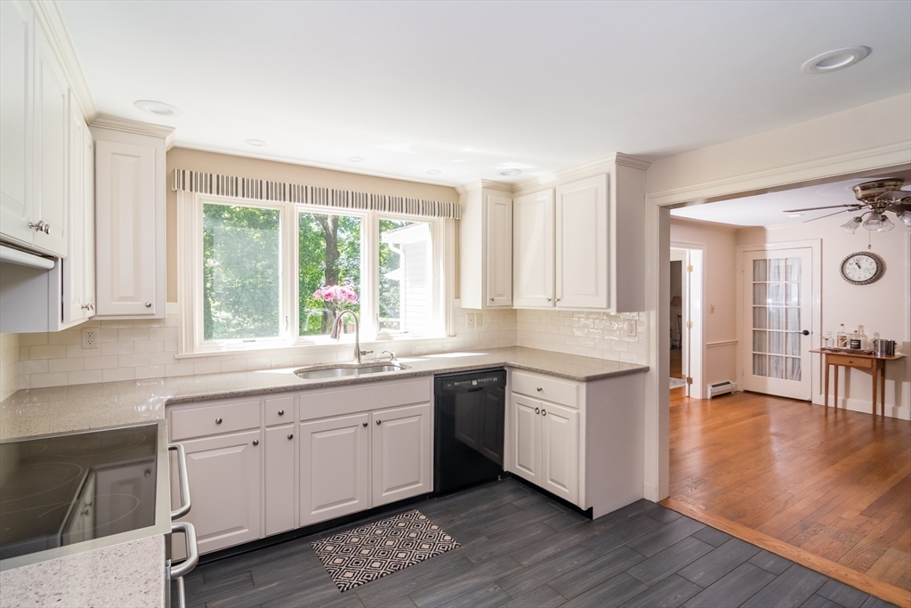 4 Philip Road Lexington, MA 02421 - Photo 4 of 19 a open kitchen with white cabinets and wooden floor