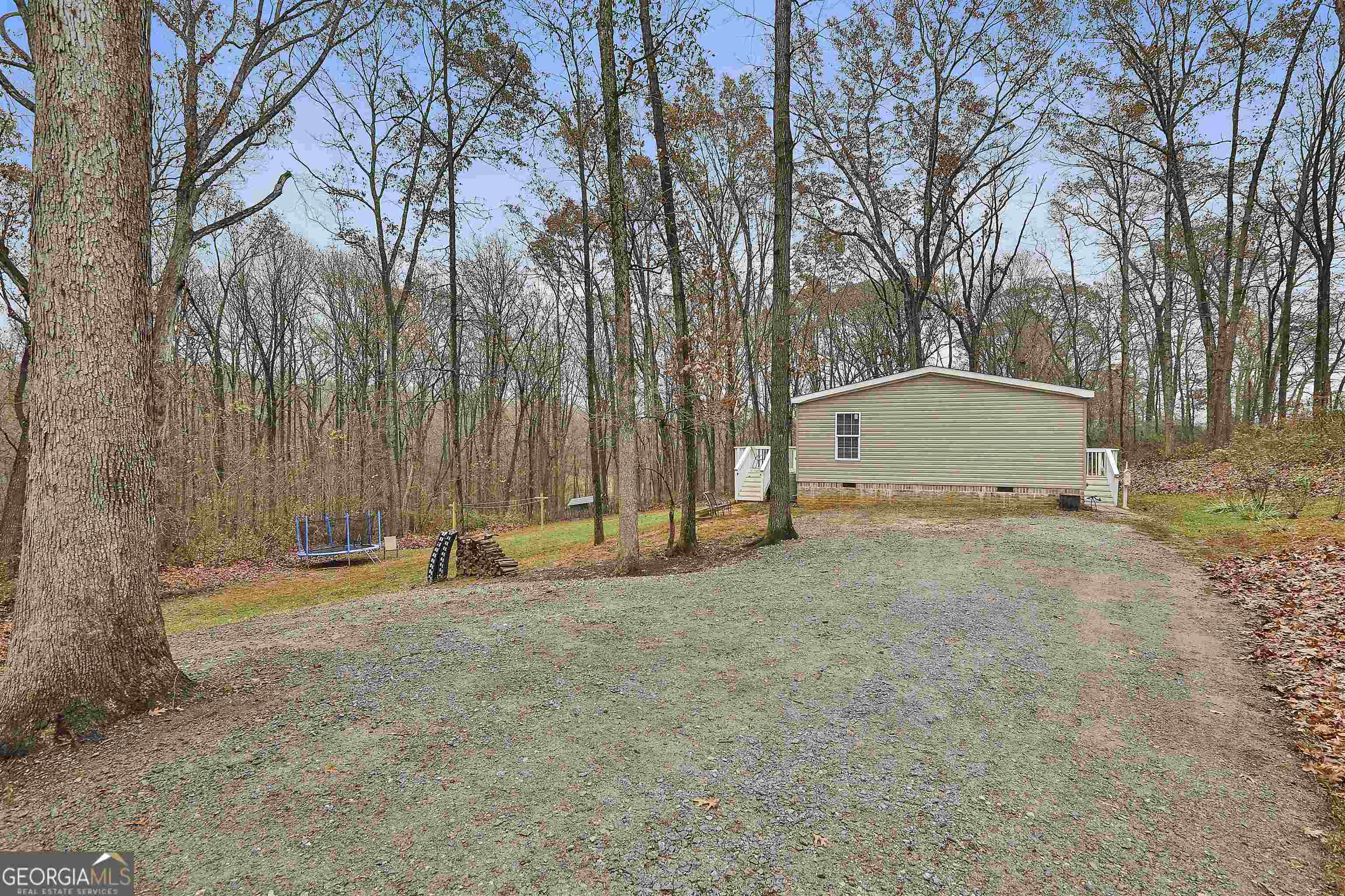 200 Potts Circle Roopville, GA 30170 - Photo 1 of 1 a view of outdoor space with trees