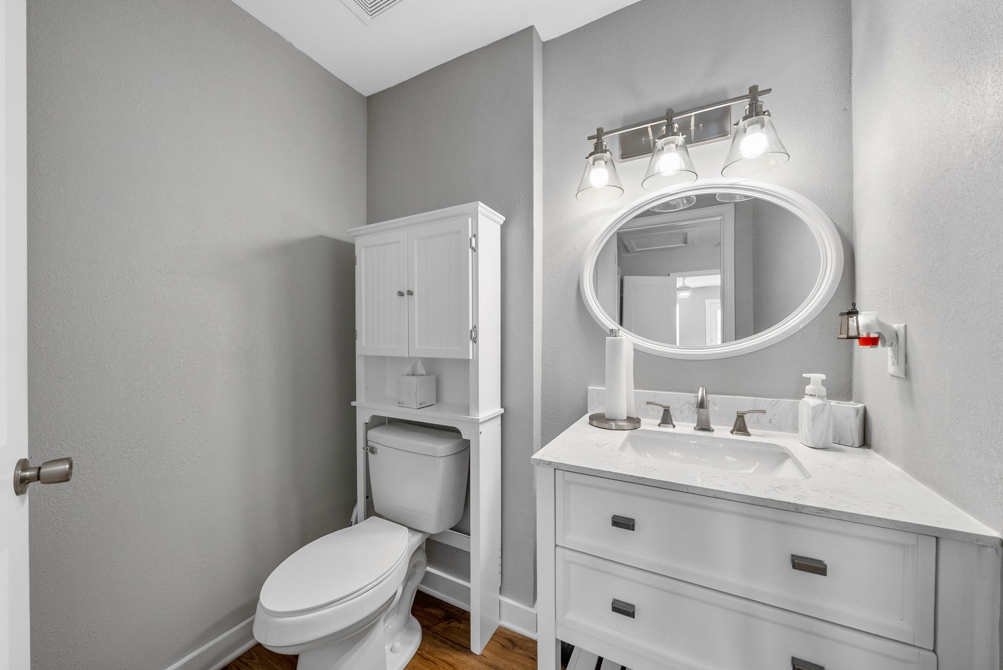939 Shearor Street Clarksville, TN 37040 - Photo 15 of 26 a bathroom with a toilet sink vanity and mirror