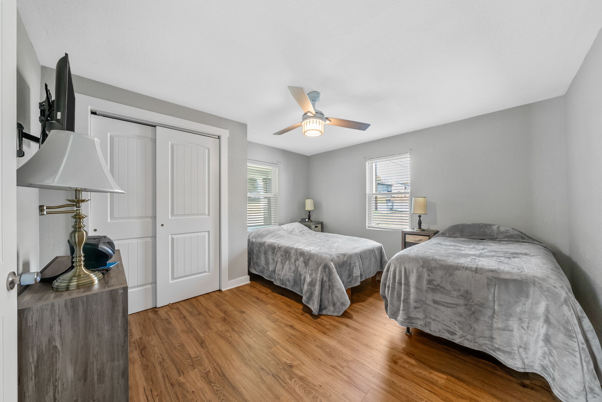 939 Shearor Street Clarksville, TN 37040 - Photo 21 of 26 a spacious bedroom with two beds and wooden floor