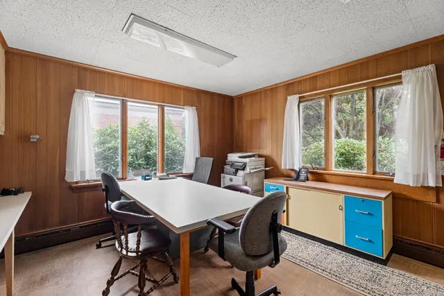 a view of a dining room with furniture window and outside view